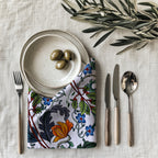 Modern luxury Mediterranean botanical napkin styled on an elegant dining table