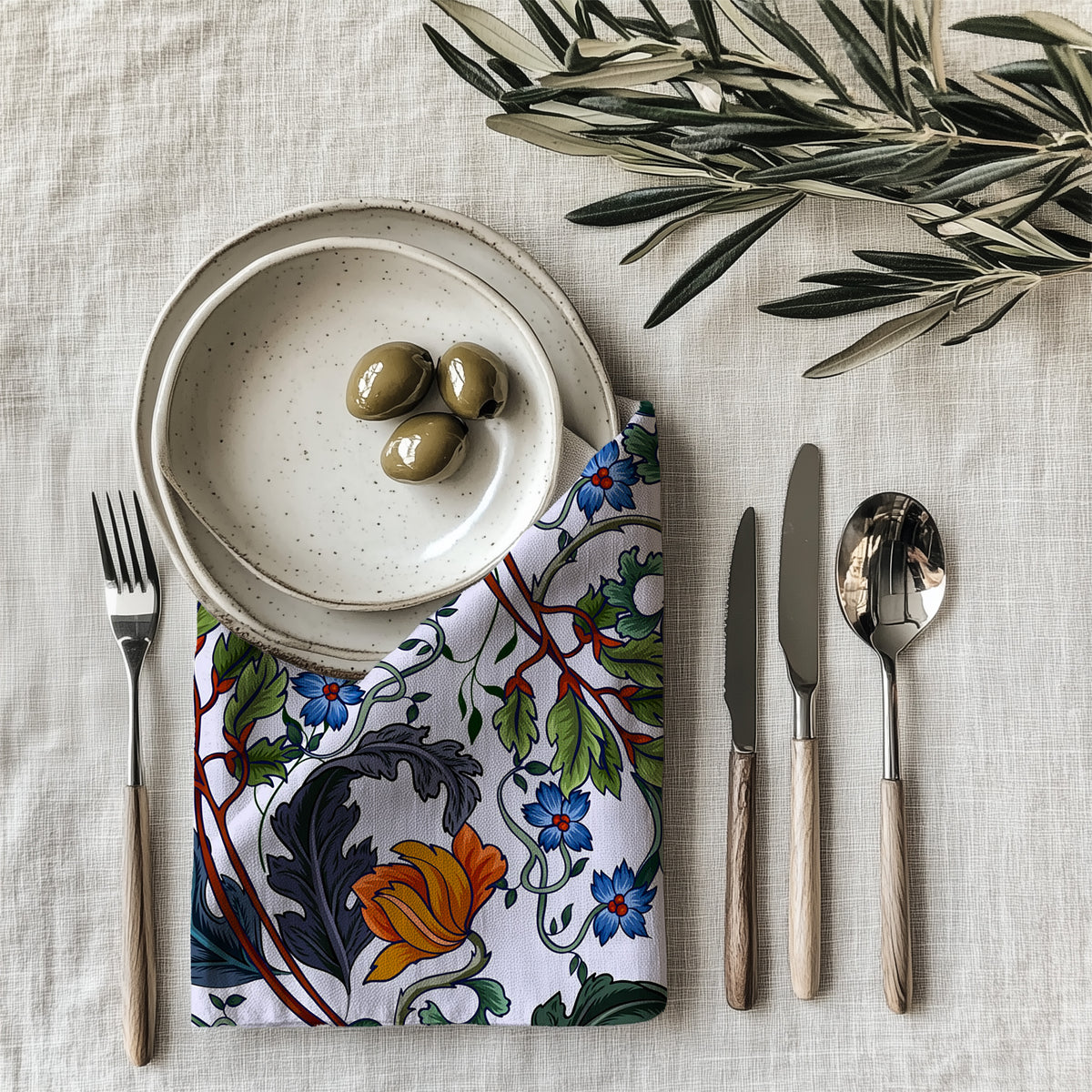 Modern luxury Mediterranean botanical napkin styled on an elegant dining table