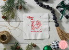 Custom Christmas party napkin featuring personalised names beneath the Merrier with a Tini Santa cocktail design in red ink.