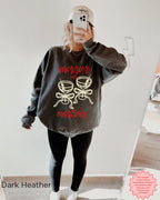 Dark Grey Gildan 18000 crewneck sweatshirt with “Merrier with a Martini” Christmas cocktail artwork, festive winter apparel.