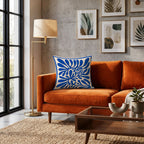 Square decorative pillow with modern blue botanical illustration and minimalist Mediterranean styling.