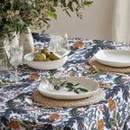 Modern floral tablecloth styled on a dining table with Mediterranean botanical motifs.