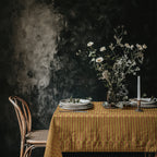 Mustard terracotta cotton twill tablecloth styled on dining table with artisan hand drawn repeat pattern