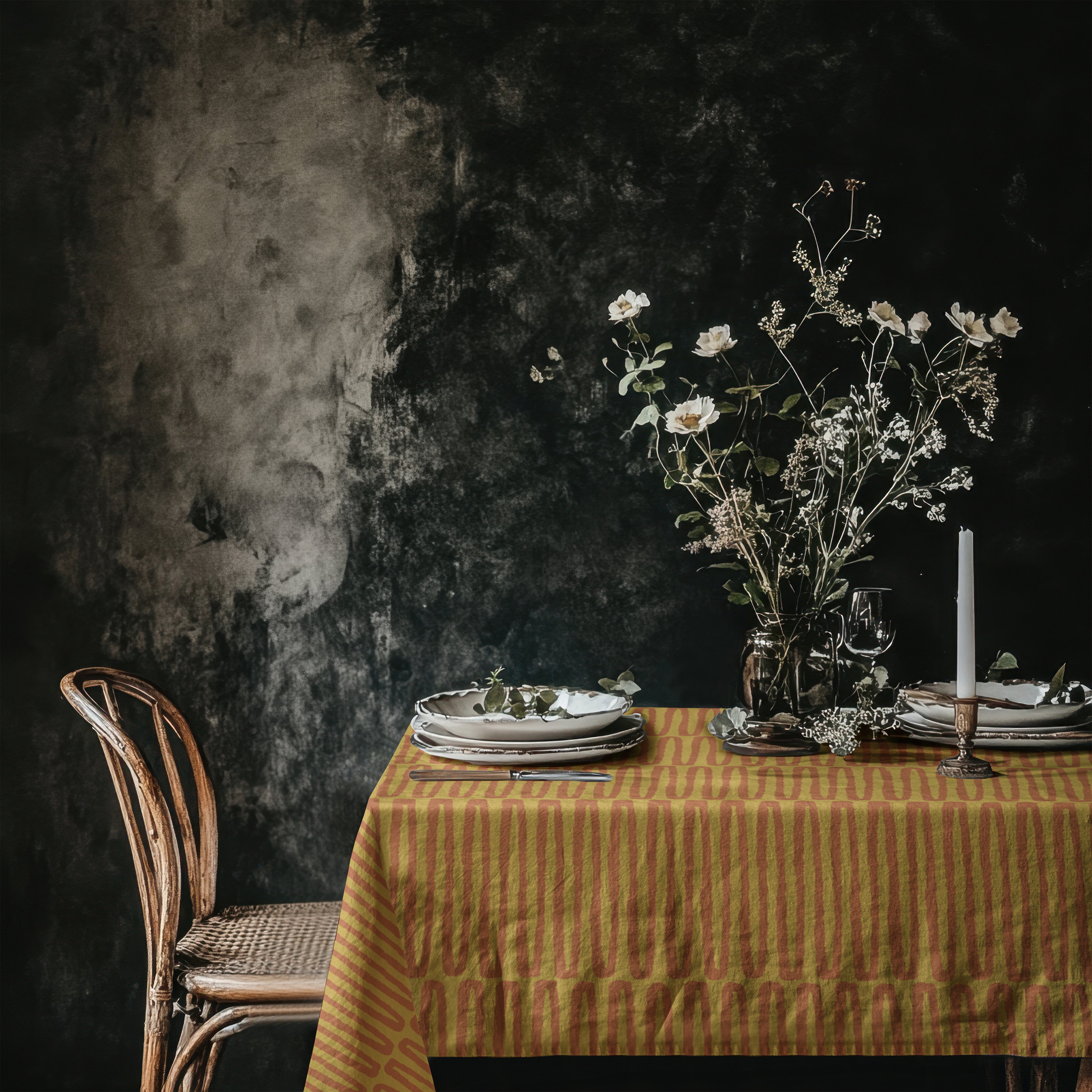 Mustard terracotta cotton twill tablecloth styled on dining table with artisan hand drawn repeat pattern