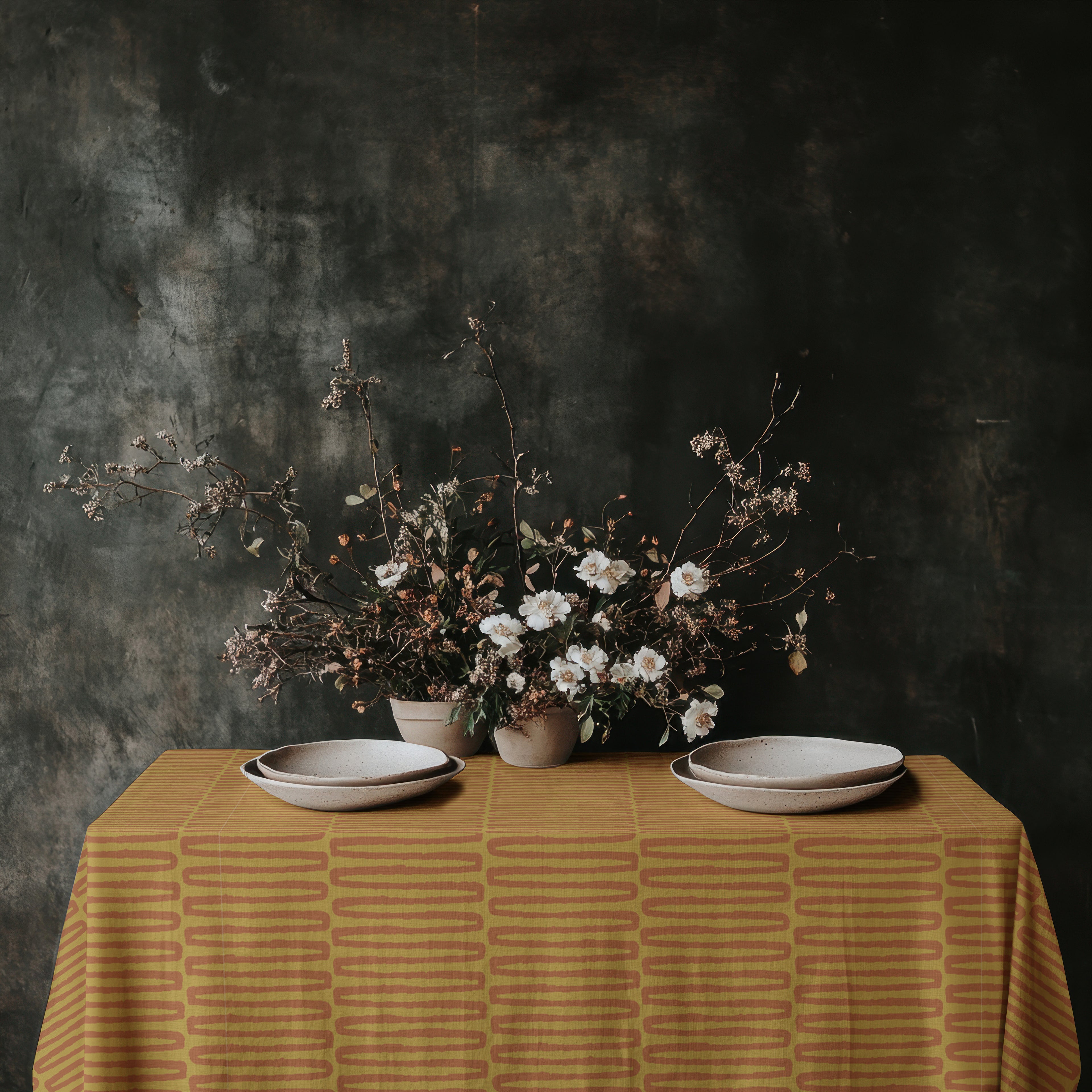 Hand drawn terracotta pattern tablecloth shown in bright minimalist dining interior
