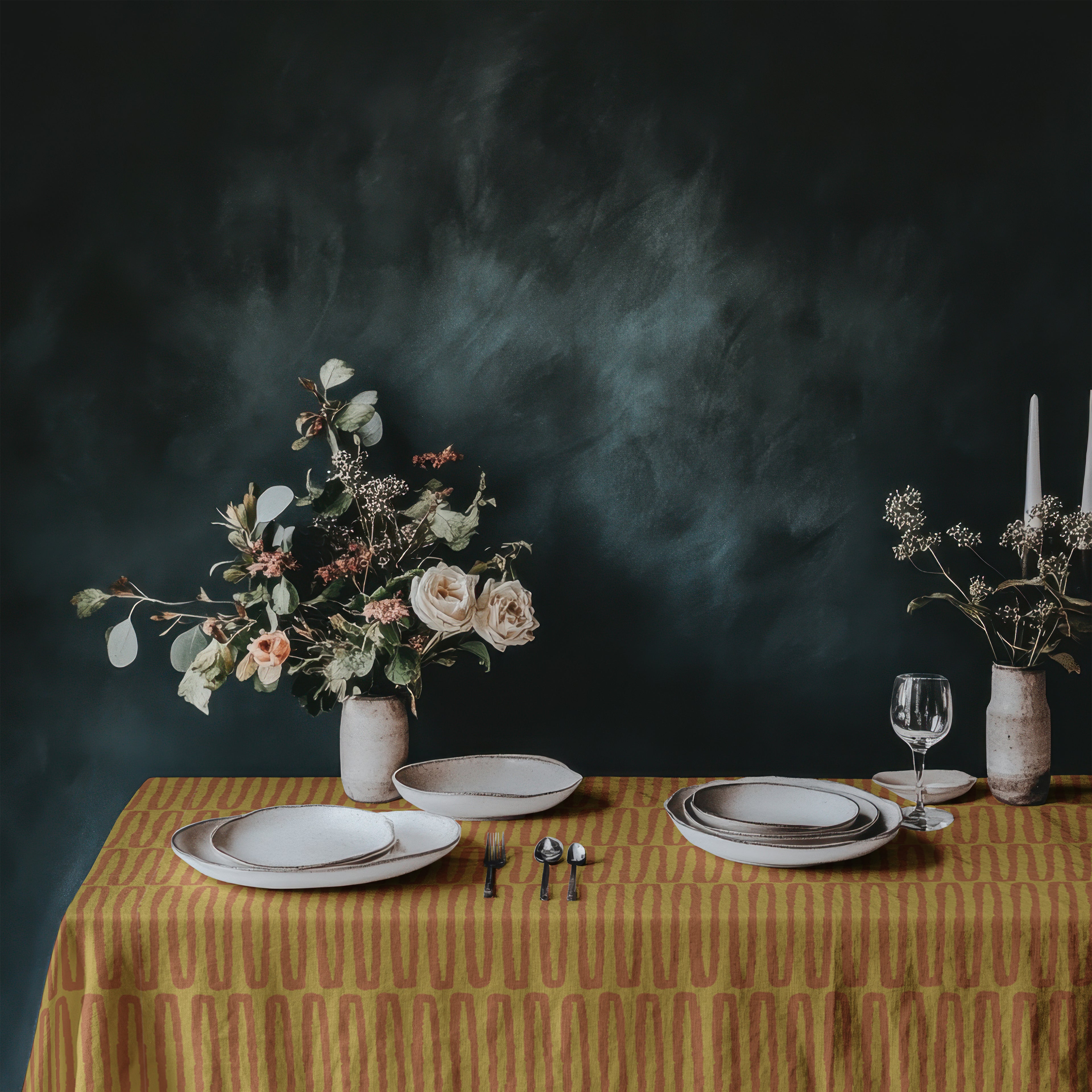Artisan cotton dining tablecloth featuring warm mustard tones and contemporary repeat design