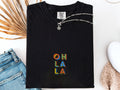 Black Oh La La embroidered boho t-shirt for women, handmade artisanal tee, casual Instagram-ready outfit, eco-friendly Comfort Colors 1717 cotton, free-spirited style