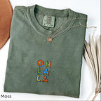 Moss green Oh La La embroidered boho t-shirt, artisanal handmade cotton tee for women, eco-conscious Comfort Colors 1717, casual Instagram-ready boho outfit