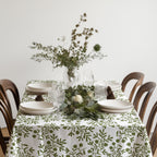 Olive grove tablecloth styled with natural textures and modern European farmhouse décor.