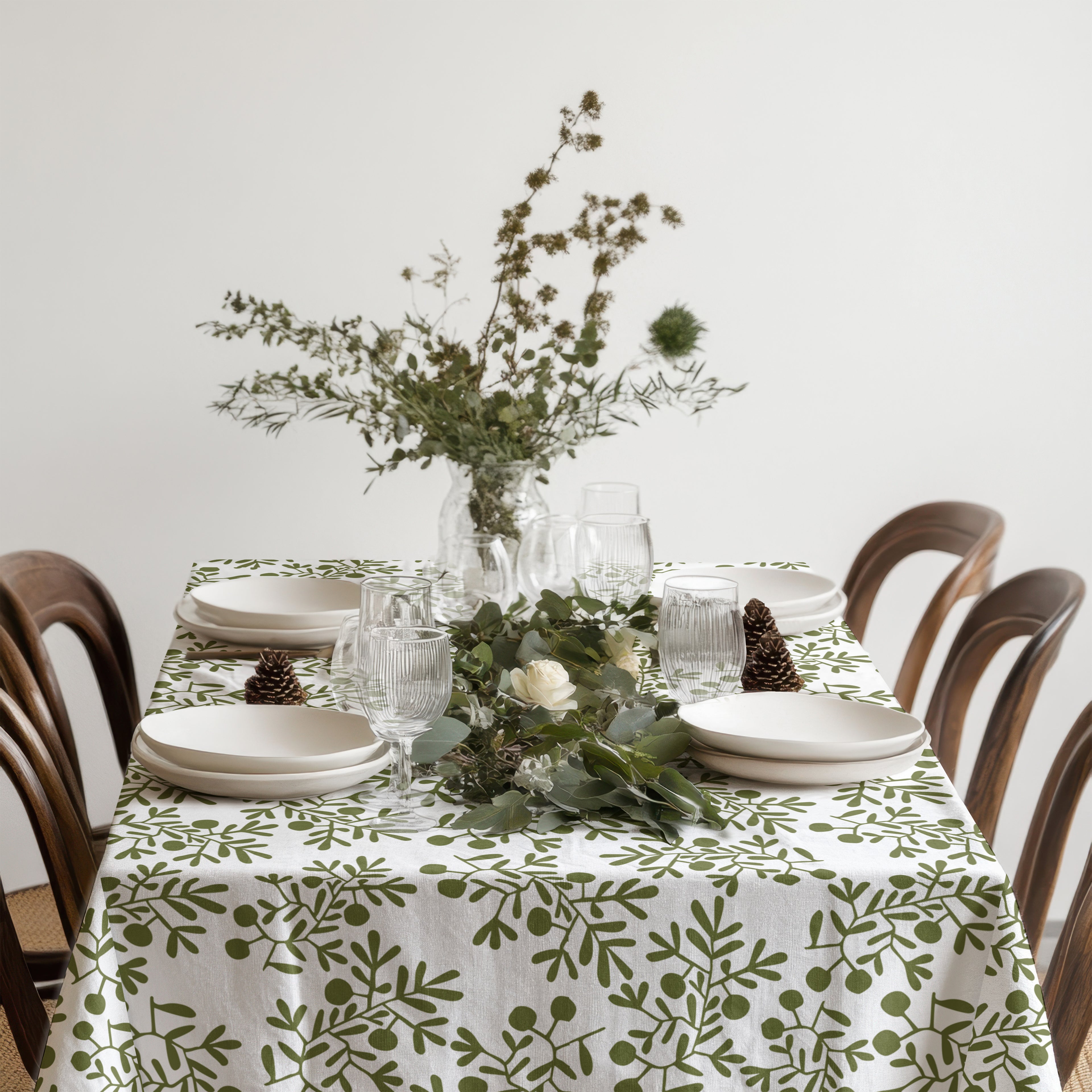 Olive grove tablecloth styled with natural textures and modern European farmhouse décor.