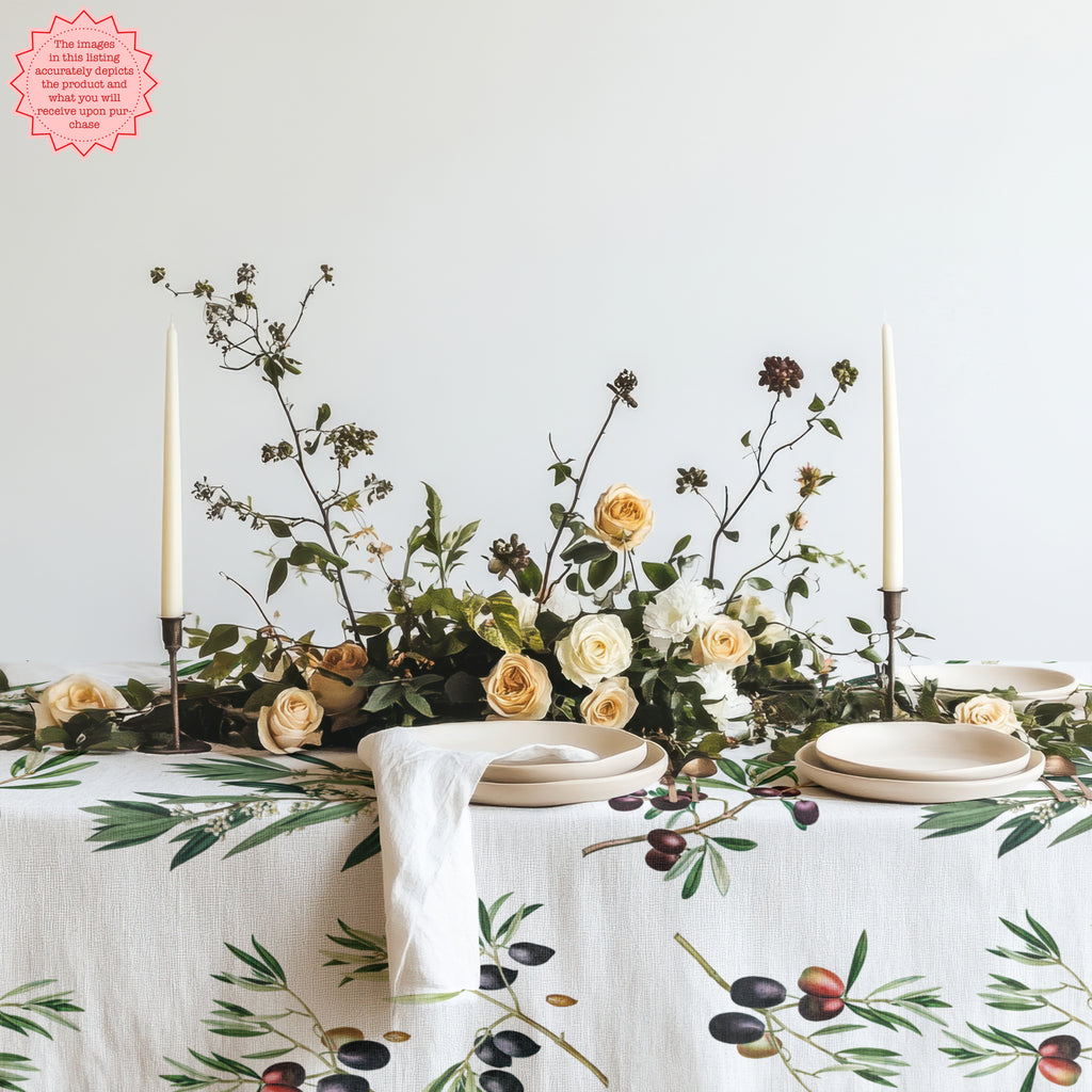 Olives Tablecloth with Olive Branches - Elegant olive branch design on a white cotton twill tablecloth, perfect for Mediterranean-inspired dining settings. Table set with natural greenery and rustic dinnerware.