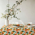 Mediterranean citrus tablecloth paired with ceramic tableware and botanical styling for effortless entertaining.