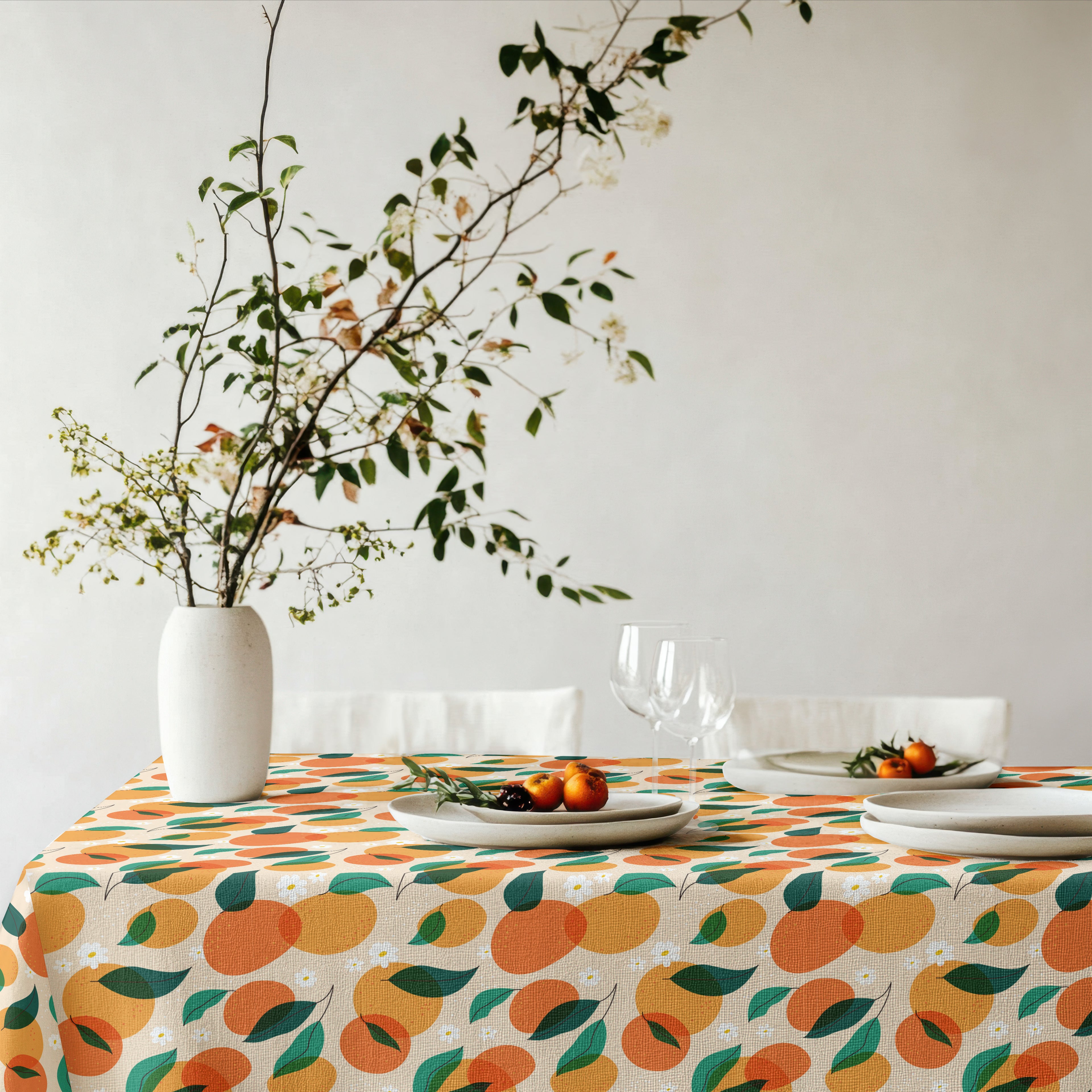 Mediterranean citrus tablecloth paired with ceramic tableware and botanical styling for effortless entertaining.