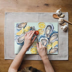Watercolor seafood and citrus kitchen decor featuring oysters and lemons on a tempered glass cutting board