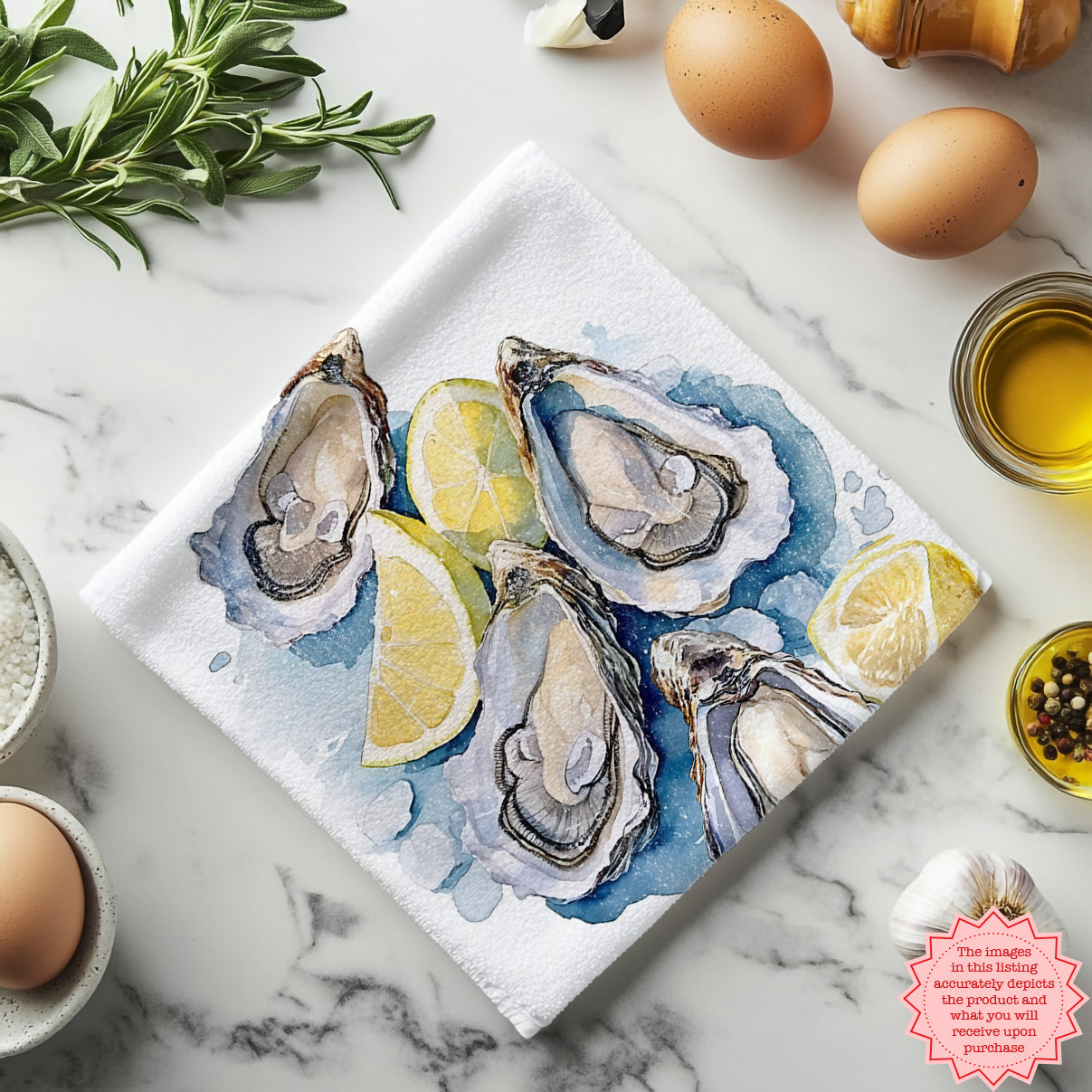Cotton tea towel featuring watercolor oyster artwork styled for coastal décor
