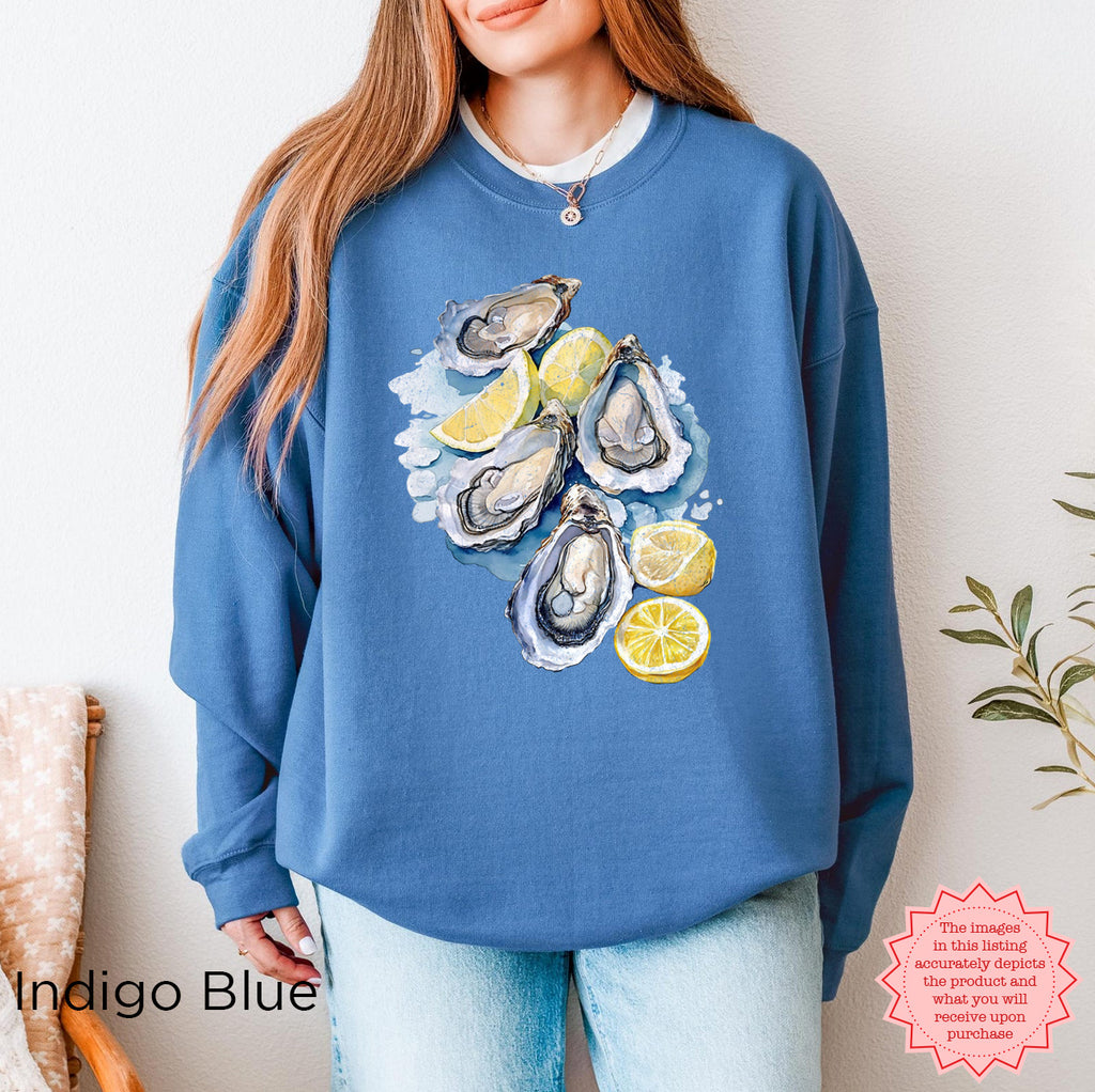 Indigo Blue Oyster Shell sweatshirt with marine life watercolor design, beachy coastal aesthetic, Gildan 18000 DTG pullover, ideal for fisherman aesthetic and seaside fashion.
