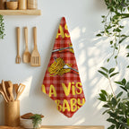 Pasta La Vista Baby cotton tea towel hanging over an oven handle with its playful spaghetti design on display.