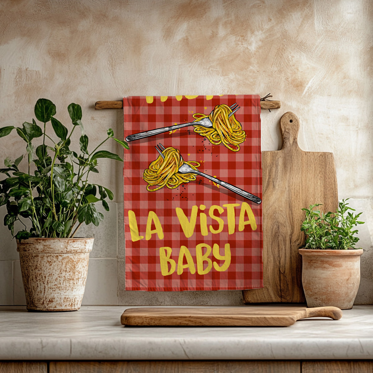 Pasta La Vista Baby cotton twill tea towel with two spaghetti forks and yellow lettering on a red gingham pattern