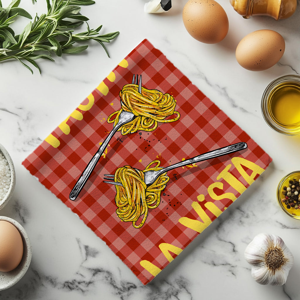 Close-up of the yellow Pasta La Vista Baby lettering on a red gingham kitchen tea towel.