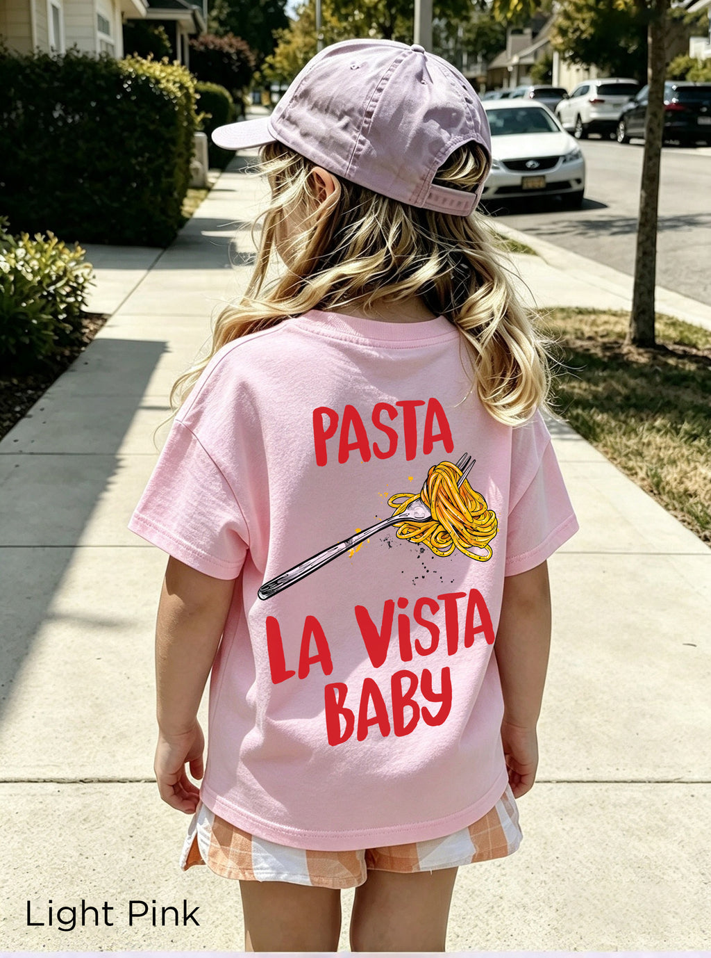 Close-up of the colourful Pasta La Vista Baby graphic printed on a kids' spaghetti lover T-shirt.