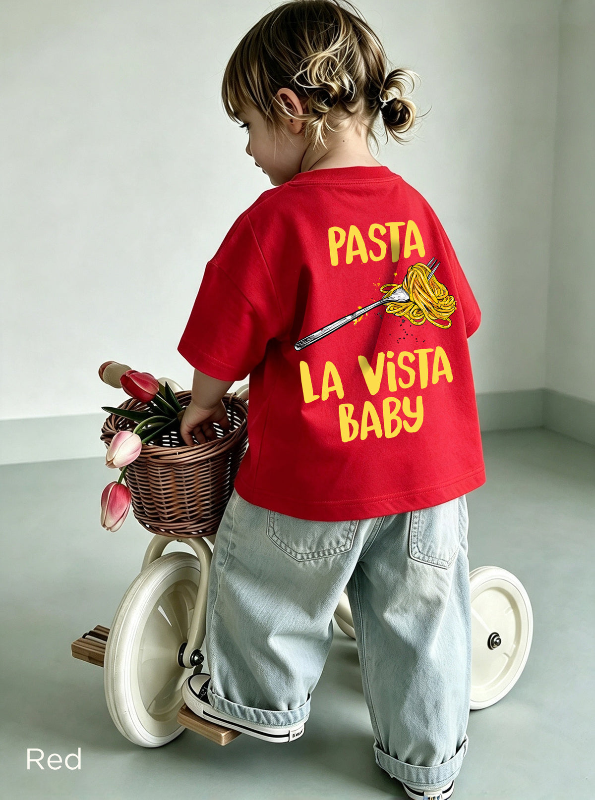 Back view of the Kids Pasta La Vista Baby graphic T-shirt with a small colourful spaghetti fork design.
