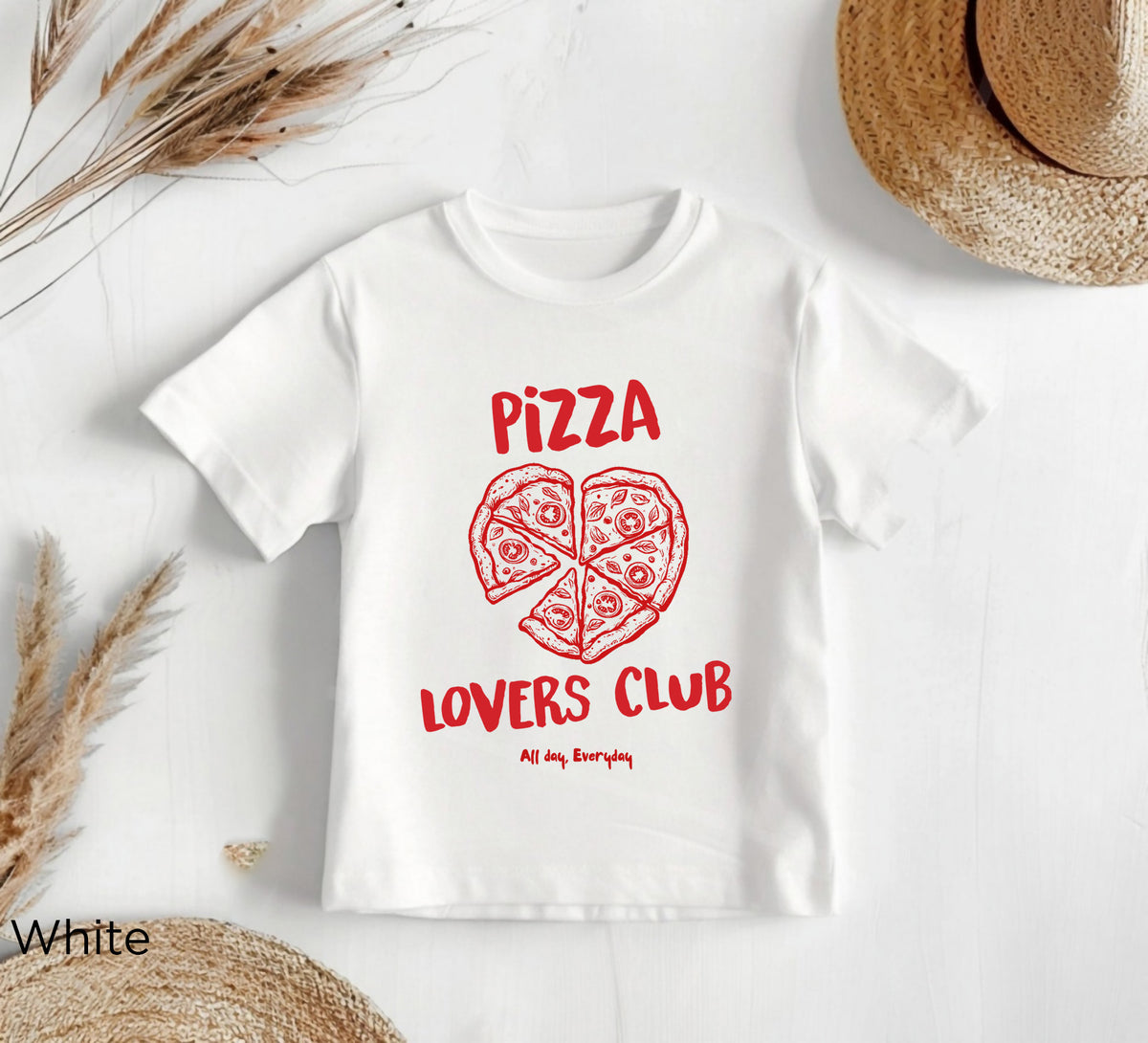 Close-up detail of heart-shaped pizza design with red lettering on toddler DTG printed T-shirt