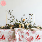 Colorful cotton twill tablecloth featuring hand-drawn pizza, pasta and Italian food illustrations, styled for family dinners and entertaining.