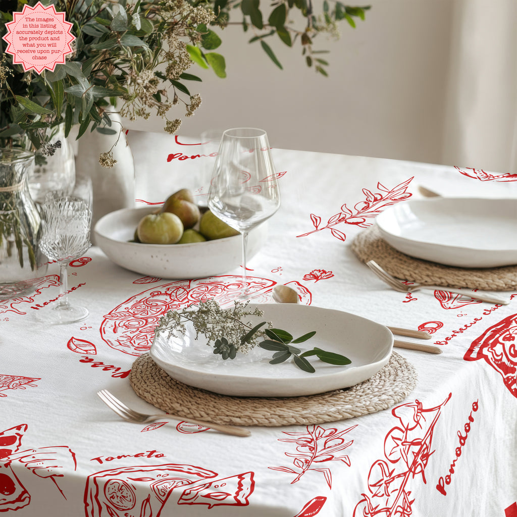 Mediterranean dining table styled with a vibrant pizza and pasta cotton twill tablecloth featuring hand-drawn food illustrations.