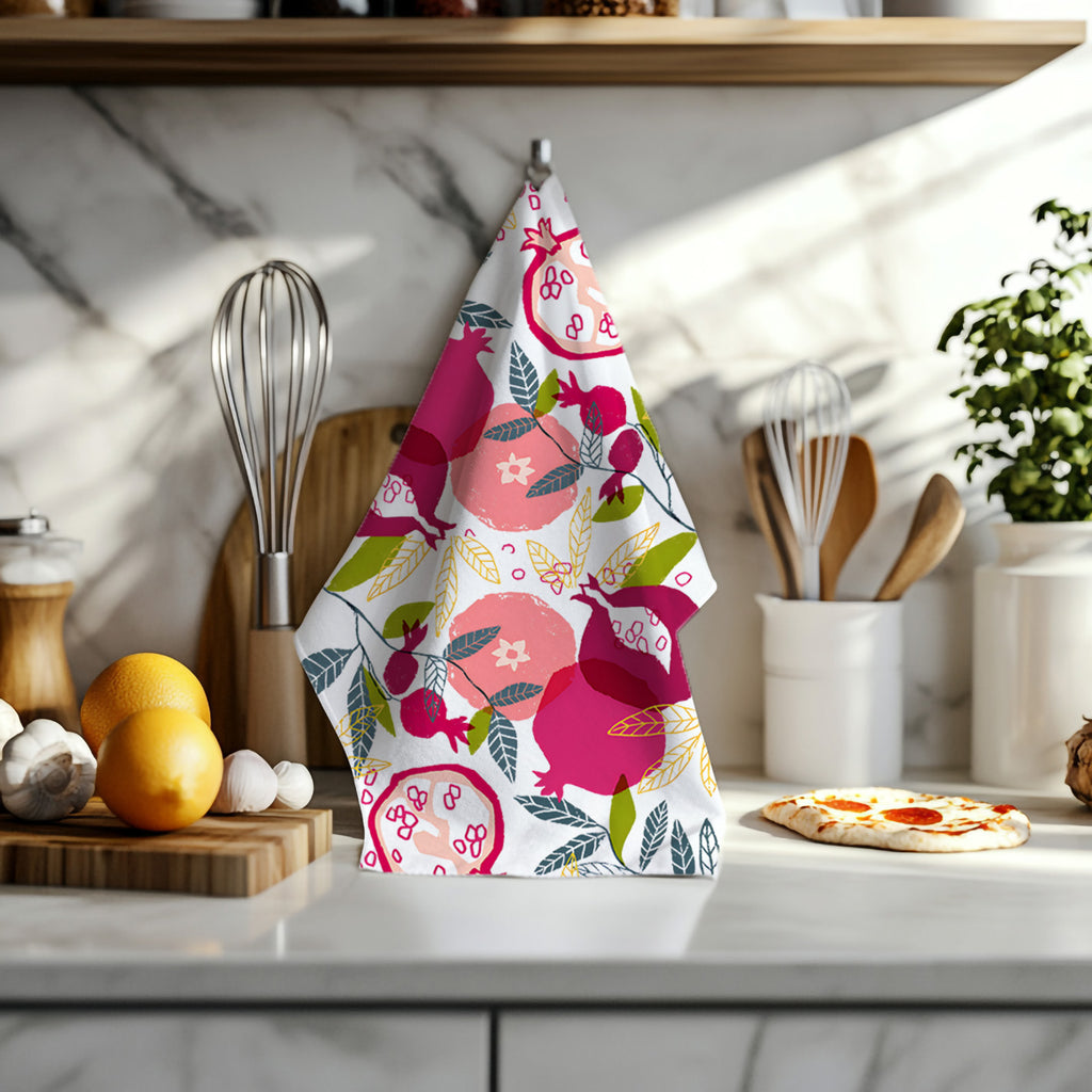 Painted pomegranate kitchen towel displayed flat showing full colorful fruit pattern