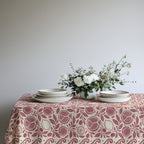 Pomegranate and citrus patterned tablecloth styled for an elegant dining setting