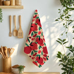 Mediterranean pomegranate tea towel featuring the That’s Amore design styled on a dining table with fork and knife