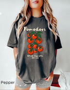 Pomodori tomato shirt styled as a casual Italian summer outfit with vibrant tomato graphic and Mediterranean-inspired aesthetic