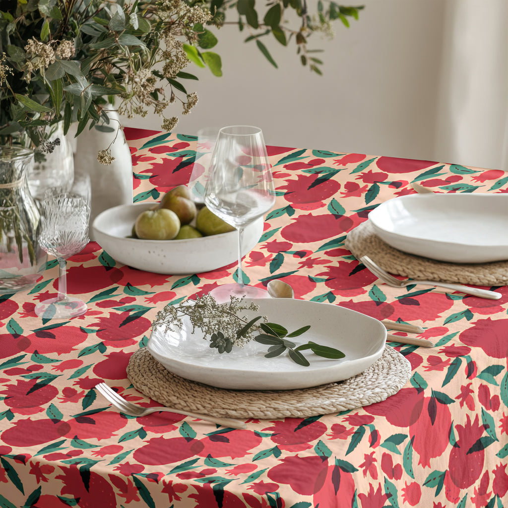 Detailed view of pomegranate tablecloth showing fabric texture and repeating fruit pattern