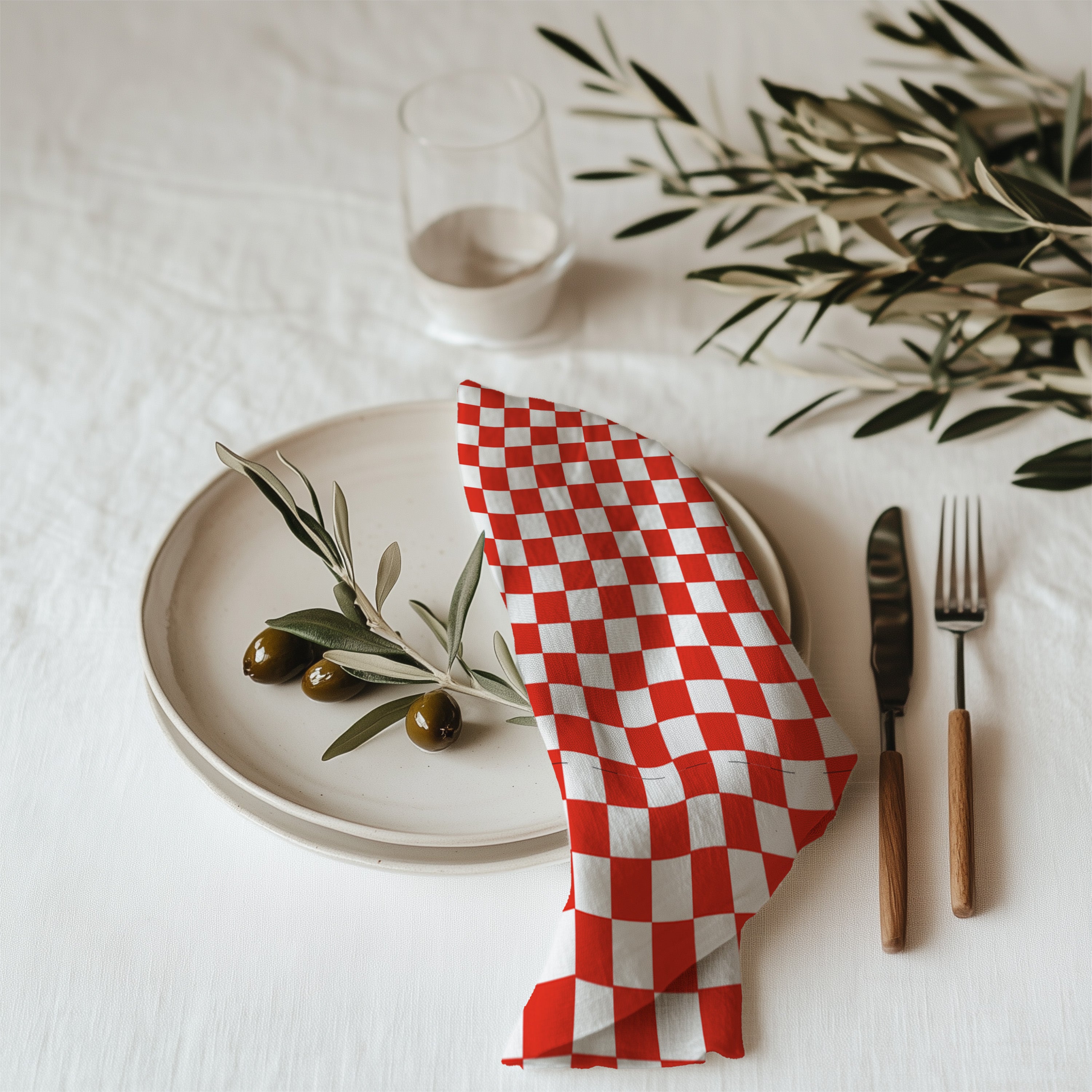 Red and white checker cotton twill cloth napkin displayed on dining table with classic farmhouse table decor