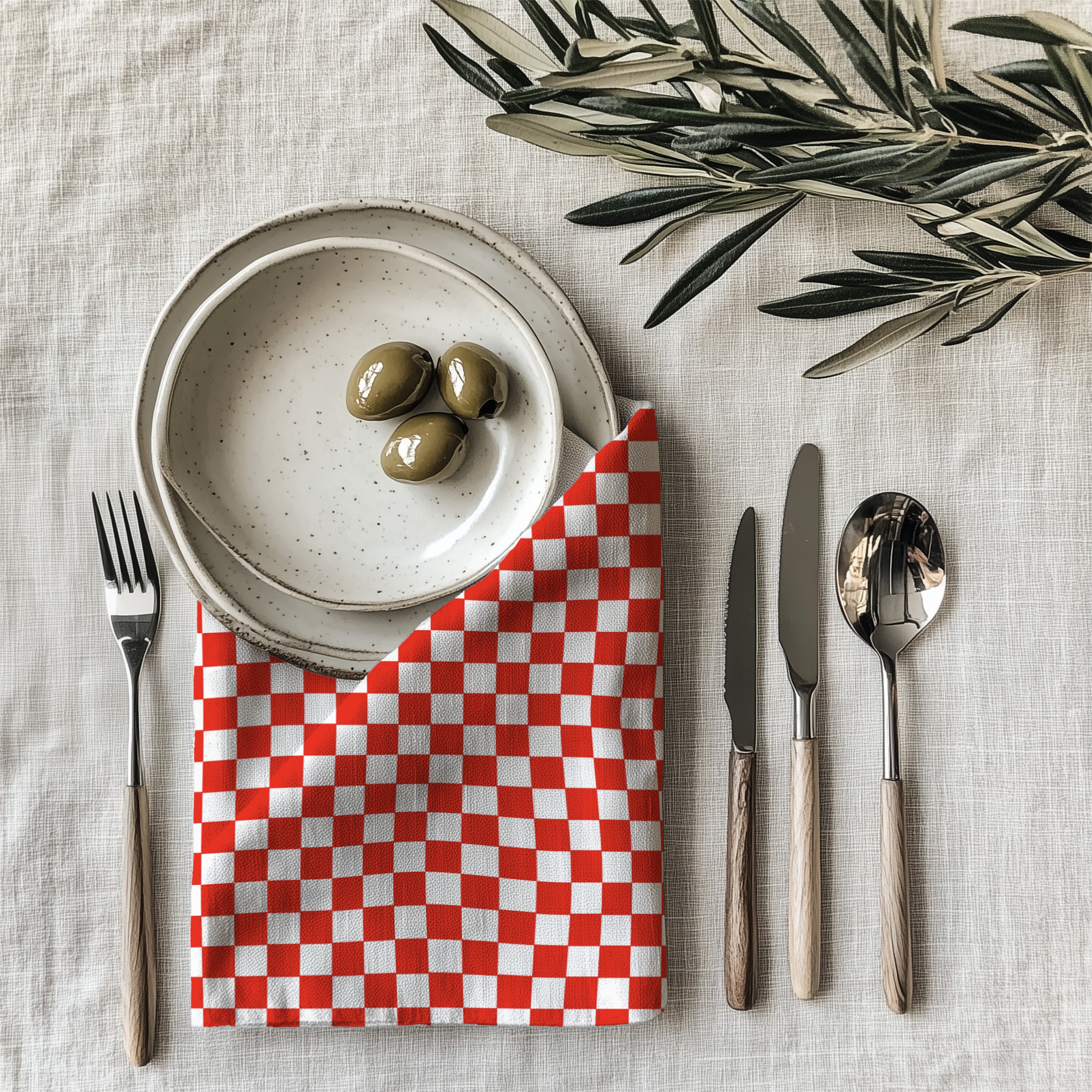 Red and white checkered cloth napkin made from 100% cotton twill with neatly hemmed edges for elegant dining