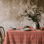 Red and white cotton tablecloth set for a festive family meal