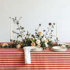 Red and white striped tablecloth styled for a relaxed weekend brunch