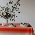 Classic red and white striped tablecloth paired with elegant tableware