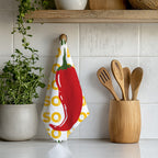 Funny chilli kitchen towel with colourful illustrated red pepper design, ideal as a unique housewarming or foodie gift.