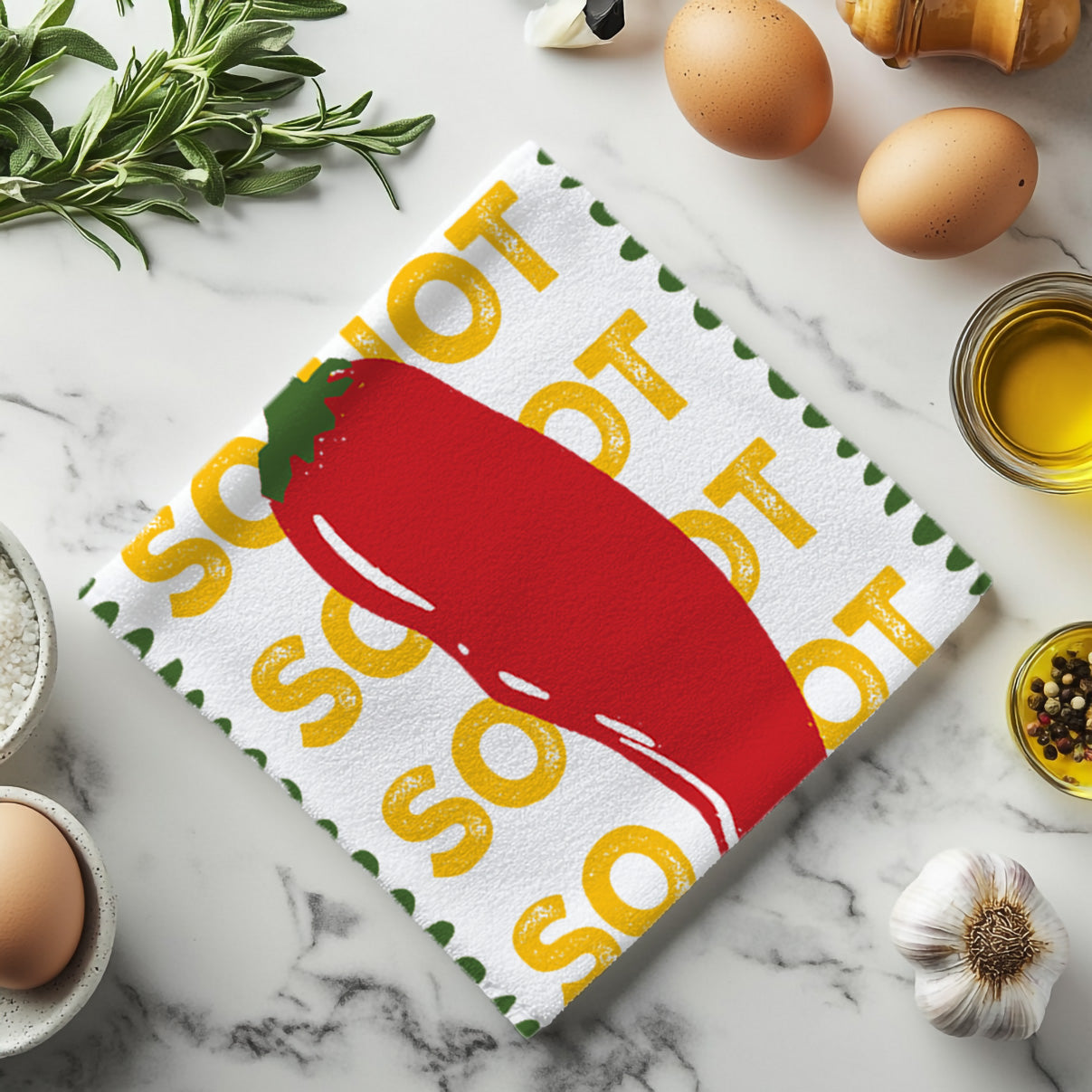 Microfiber kitchen towel with vibrant red chilli illustration and fun So Hot slogan, ideal for food lovers and home cooks.