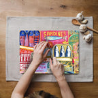 Colourful sardine collage artwork printed on a textured tempered glass cutting board