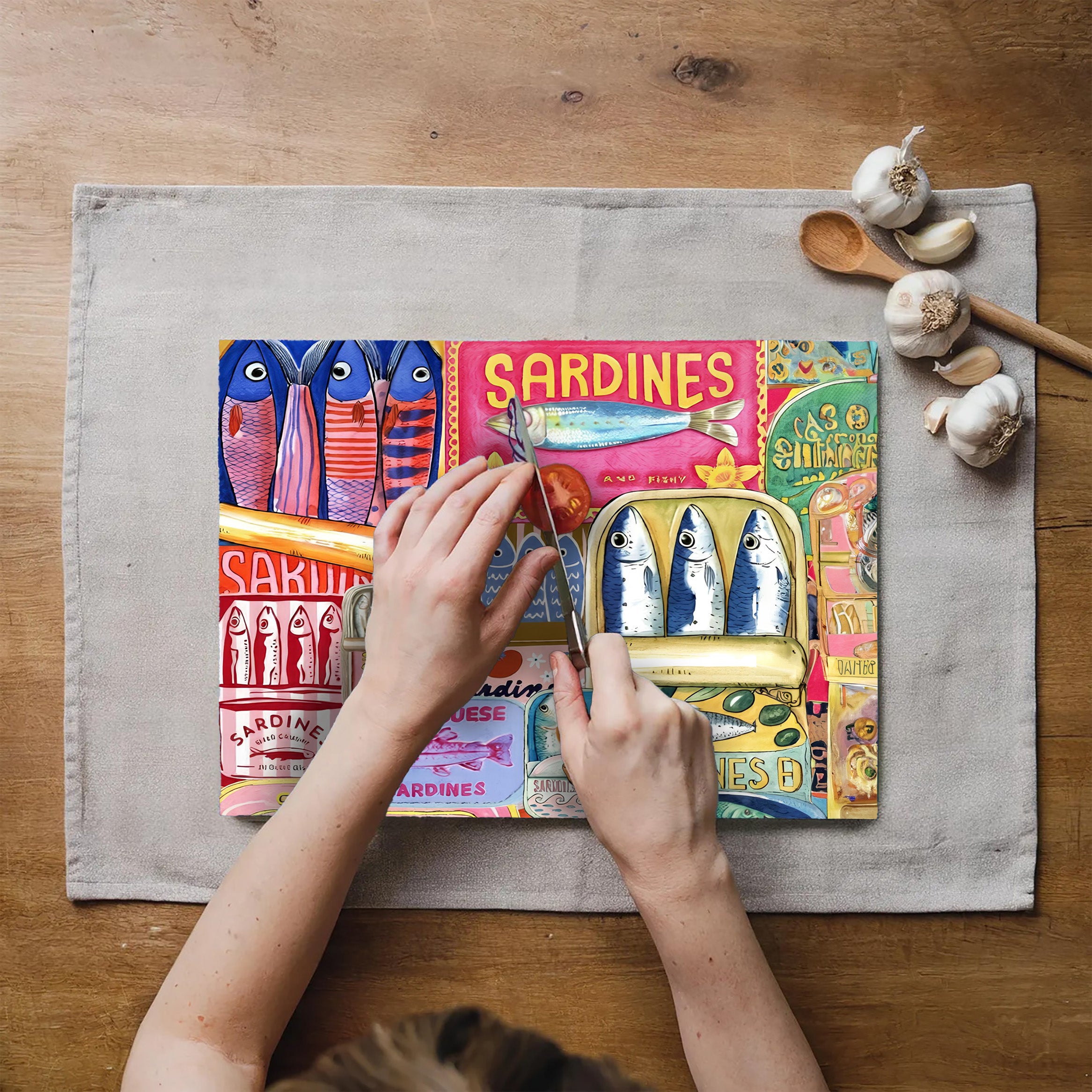 Colourful sardine collage artwork printed on a textured tempered glass cutting board