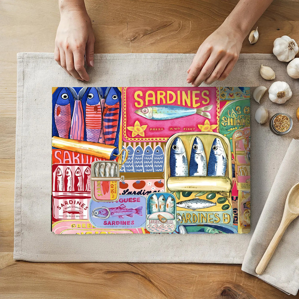 Mediterranean sardines glass cutting board featuring colourful modern fisherman collage artwork styled as coastal kitchen decor