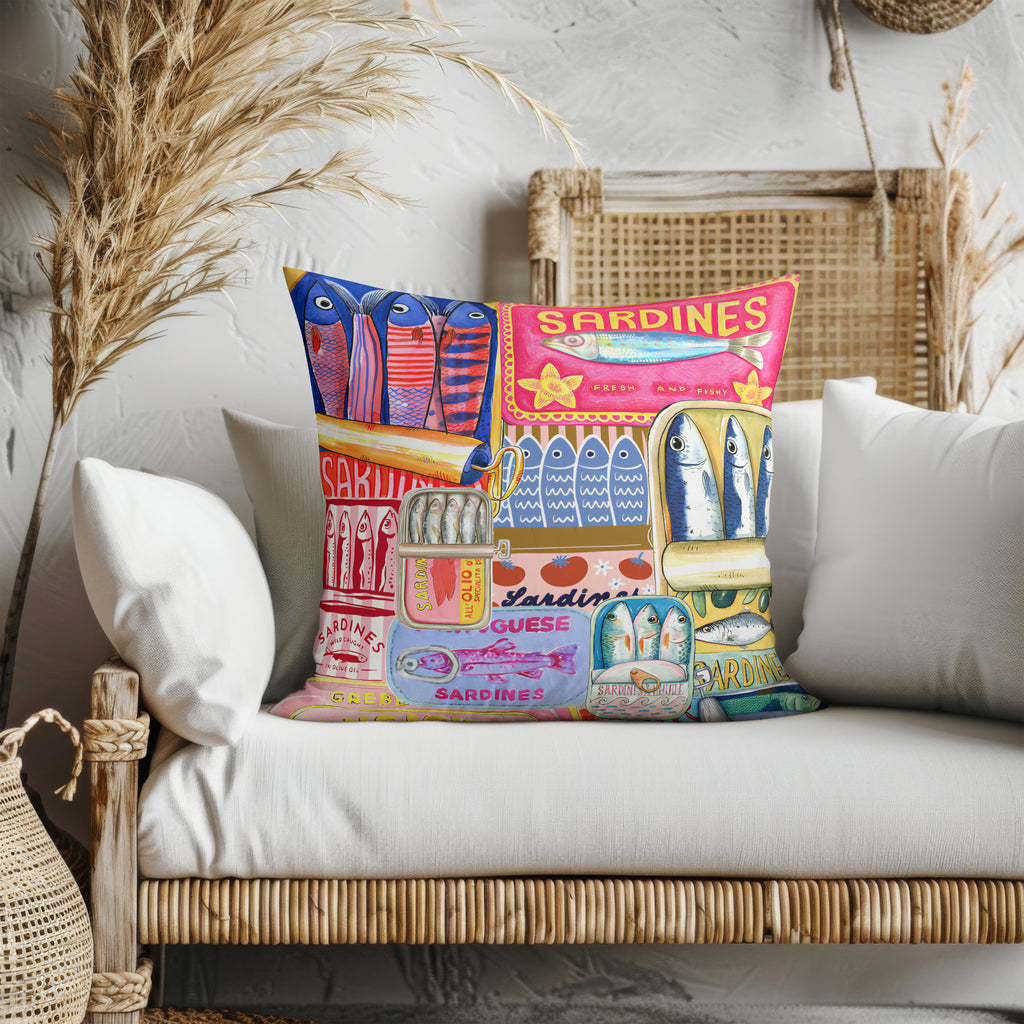 Front view of the Sardines cushion in velveteen fabric, with bright and bold sardine can print, bringing Mediterranean charm to any room.