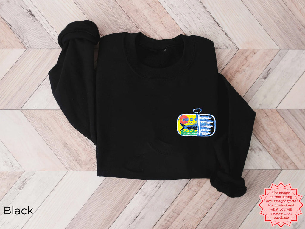 Black sardines embroidered sweatshirt with vibrant embroidered canned fish design — unisex casual graphic sweater.