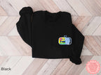 Black sardines embroidered sweatshirt with vibrant embroidered canned fish design — unisex casual graphic sweater.