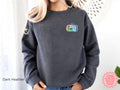 Dark heather sardines embroidered crewneck sweatshirt with colorful embroidered design, stylish unisex fit.