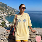 Beachy, seashell graphic tee for a sunny, relaxed summer vibe.