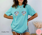 Fun seashell design in chalky mint, adding a refreshing touch to your summer look.