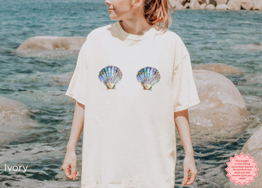 Stylish ivory seashell graphic tee for beach-inspired vibes.